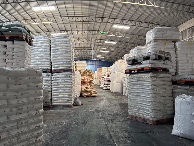 warehouse with stacked plastic logistics containers